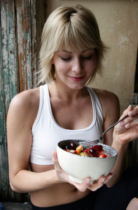 Lady eating healthy high fiber foods.